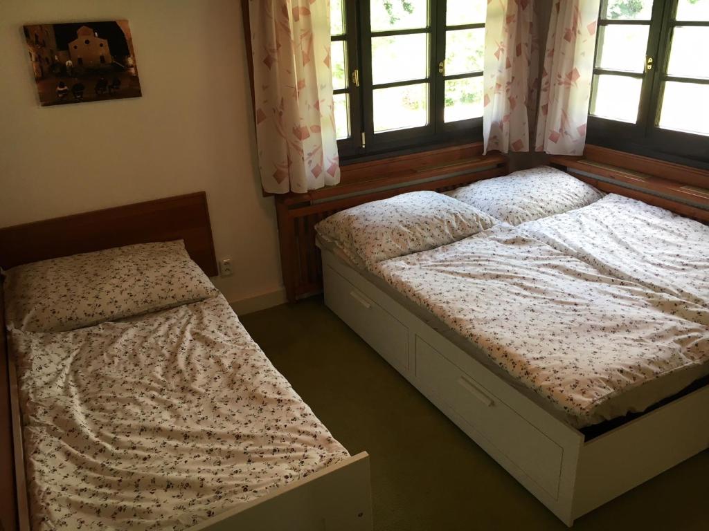 Postel nebo postele na pokoji v ubytování CHATA Privlaky
