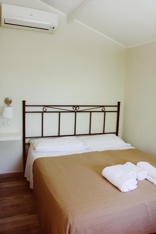 Łóżko lub łóżka w pokoju w obiekcie Agriturismo San Leonardo