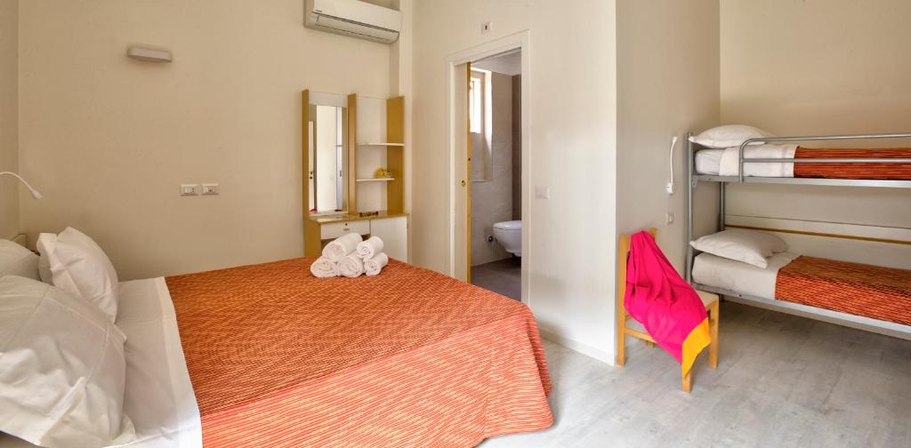 Postel nebo postele na pokoji v ubytování Hotel Clara