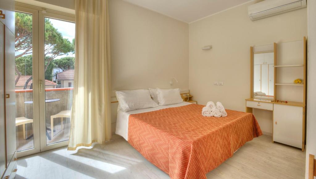 Postel nebo postele na pokoji v ubytování Hotel Clara