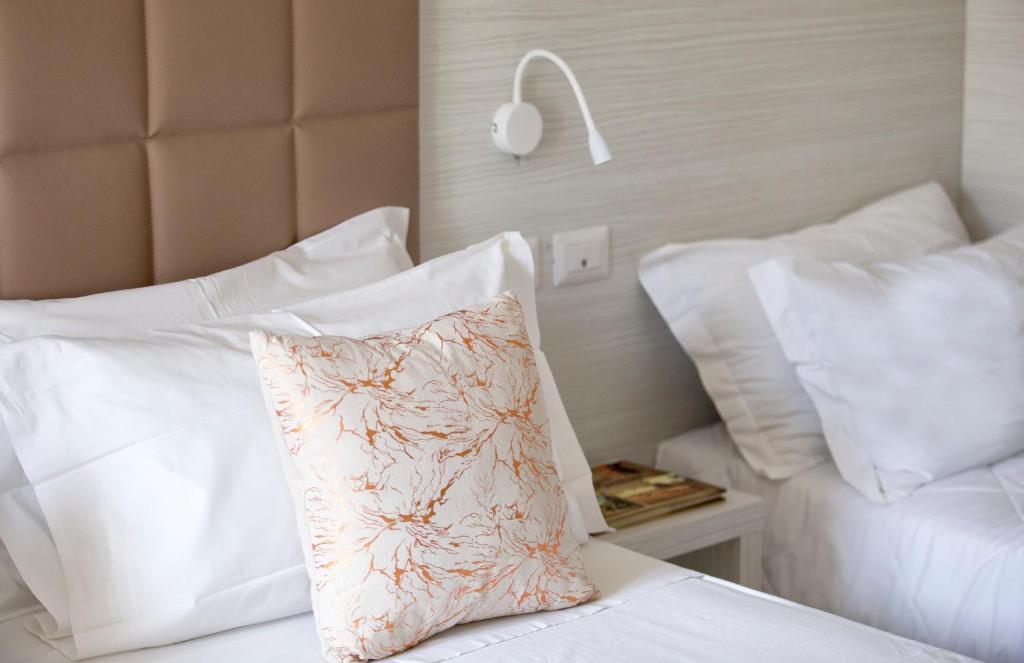 Postel nebo postele na pokoji v ubytování Hotel Clara