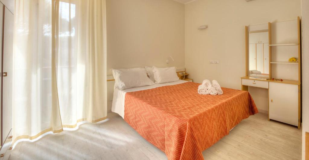 Postel nebo postele na pokoji v ubytování Hotel Clara