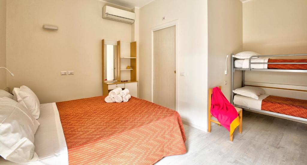 Postel nebo postele na pokoji v ubytování Hotel Clara