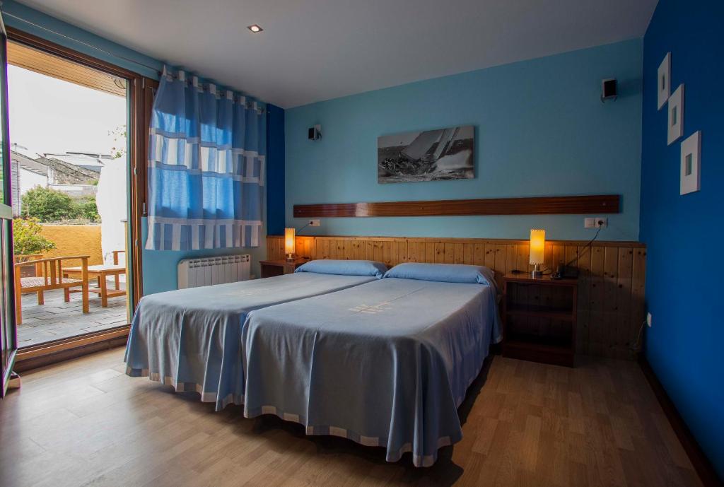 Postel nebo postele na pokoji v ubytování Hotel A. G. Porcillan