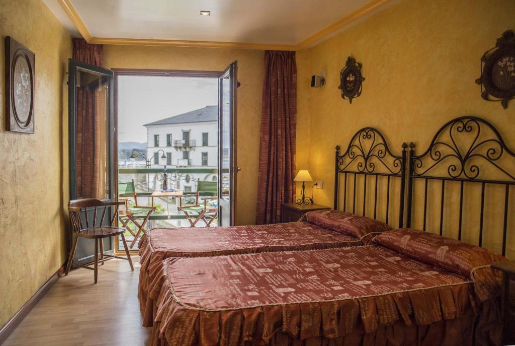Postel nebo postele na pokoji v ubytování Hotel A. G. Porcillan