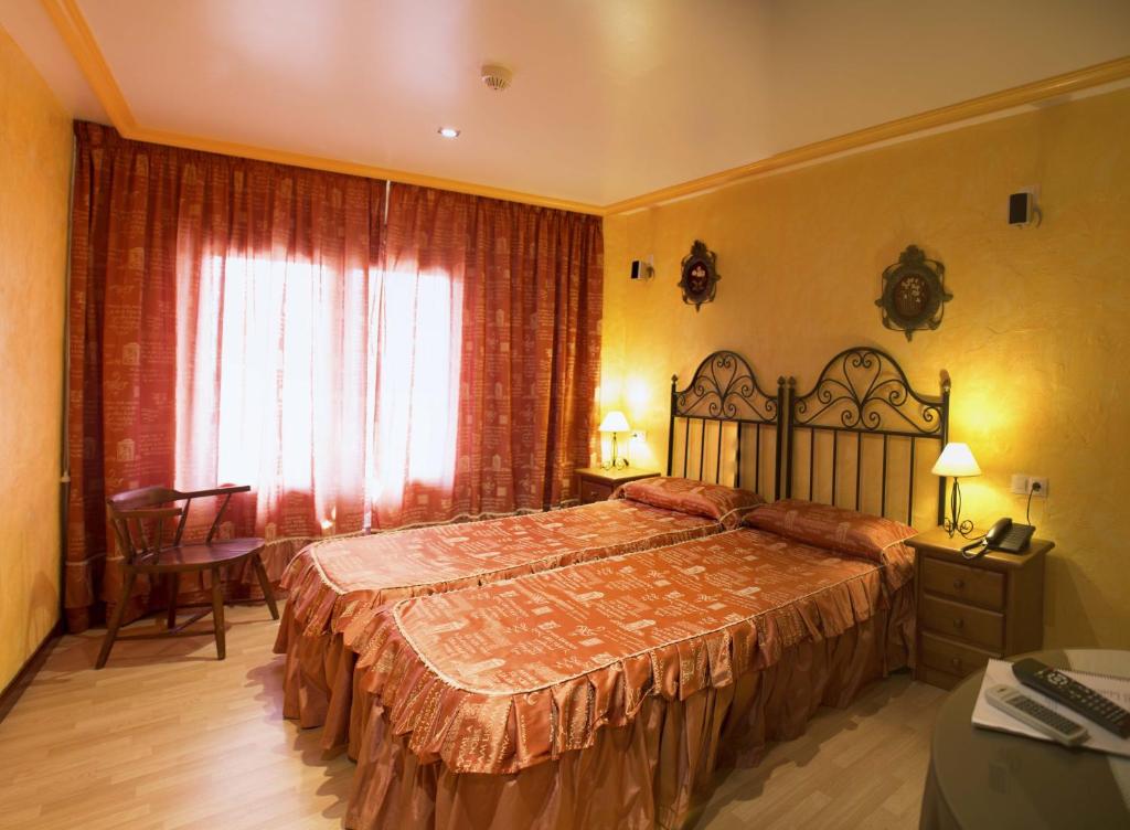Postel nebo postele na pokoji v ubytování Hotel A. G. Porcillan