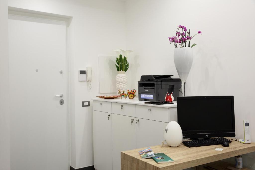 Kuchyň nebo kuchyňský kout v ubytování Amuri Room&Suite