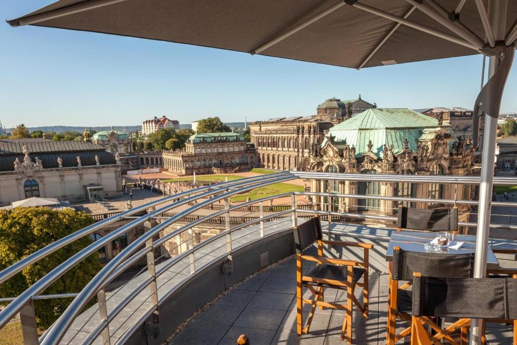 a balcony with a view of a city at Staycity Aparthotels Dresden City Centre in Dresden