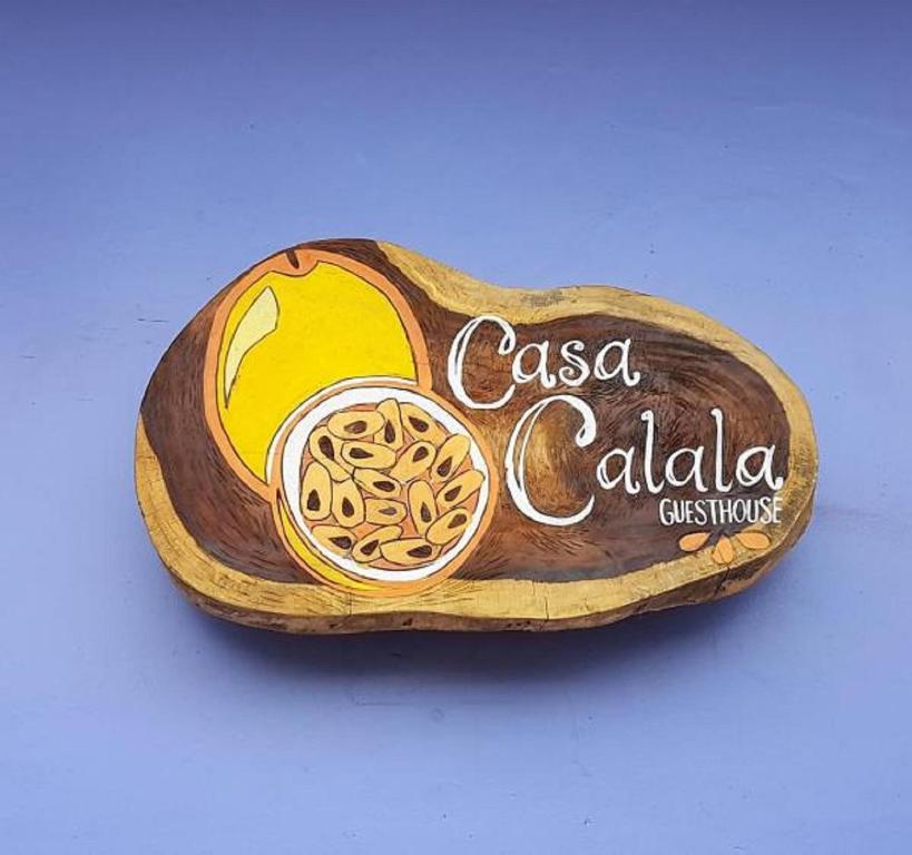 a sign for a casserole dish with casa cola at Casa Calala in Granada