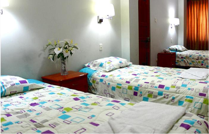 Postel nebo postele na pokoji v ubytování Hostal Residencial Lino