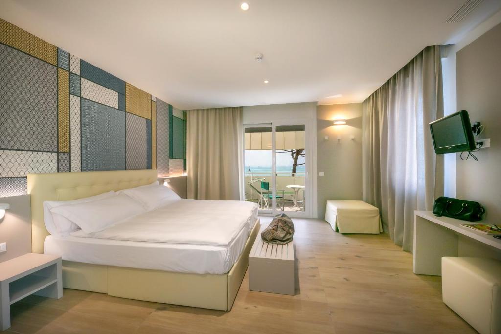 Postel nebo postele na pokoji v ubytování Hotel Le Lampare