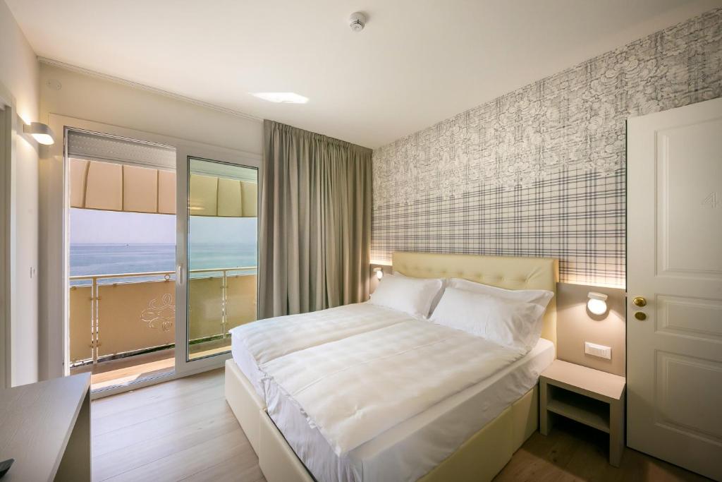 Postel nebo postele na pokoji v ubytování Hotel Le Lampare
