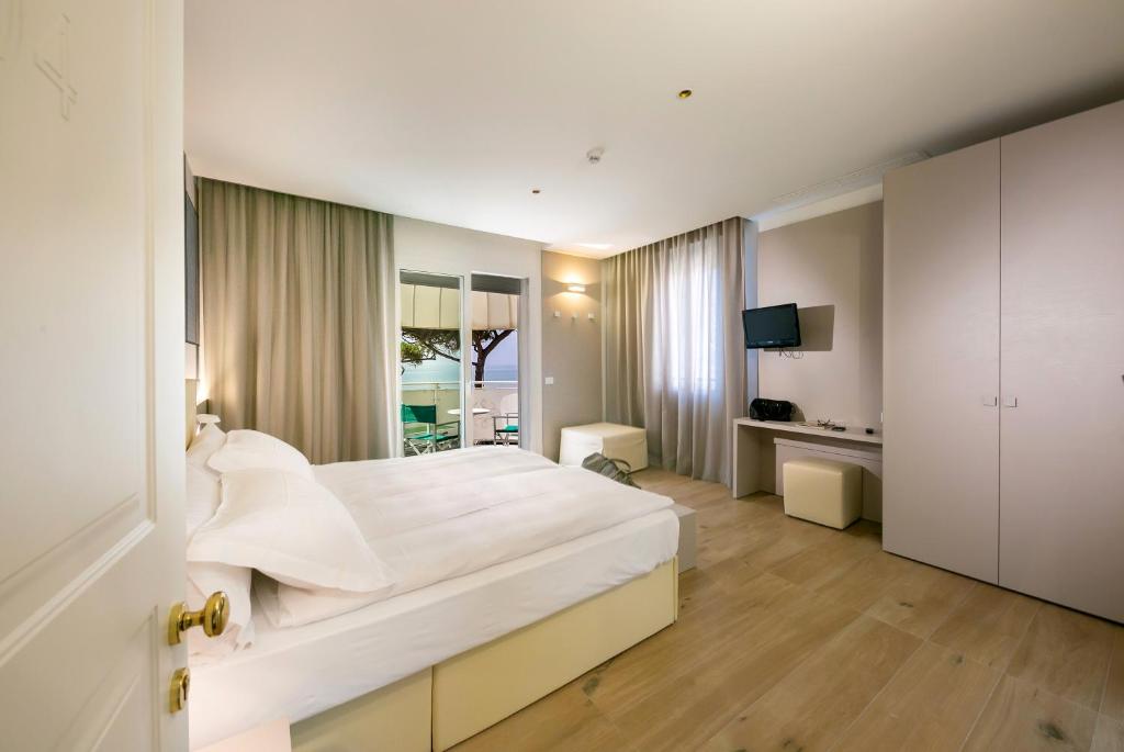 Postel nebo postele na pokoji v ubytování Hotel Le Lampare