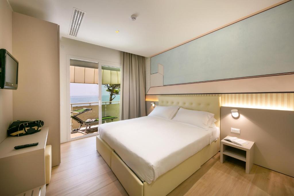 Postel nebo postele na pokoji v ubytování Hotel Le Lampare