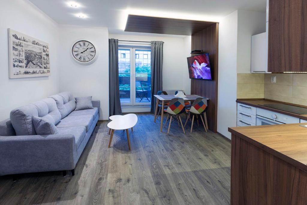 a living room with a couch and a table at Rooftop apartment II. in Košice