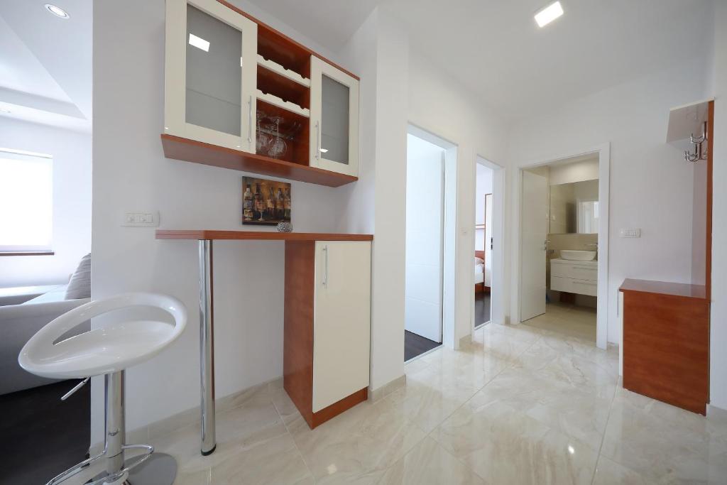 Kuchyňa alebo kuchynka v ubytovaní Apartmani Postimana