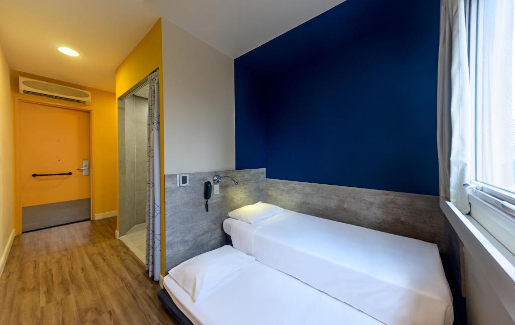 Cama ou camas em um quarto em ibis budget Sao Paulo Morumbi