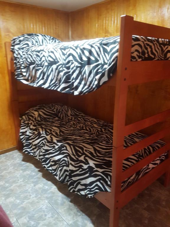 Voodi või voodid majutusasutuse Cabaña Tongariki toas
