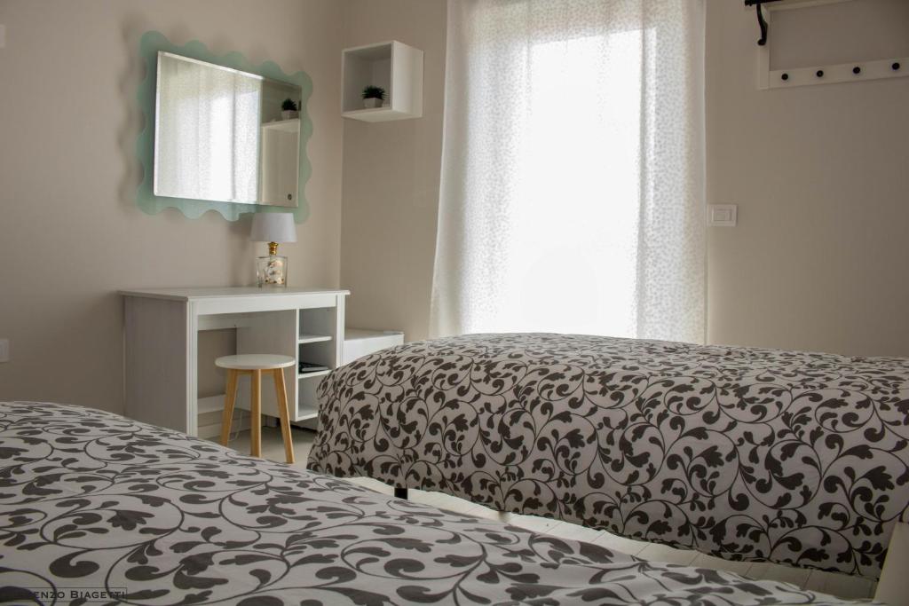 Postel nebo postele na pokoji v ubytování B&B Geolja