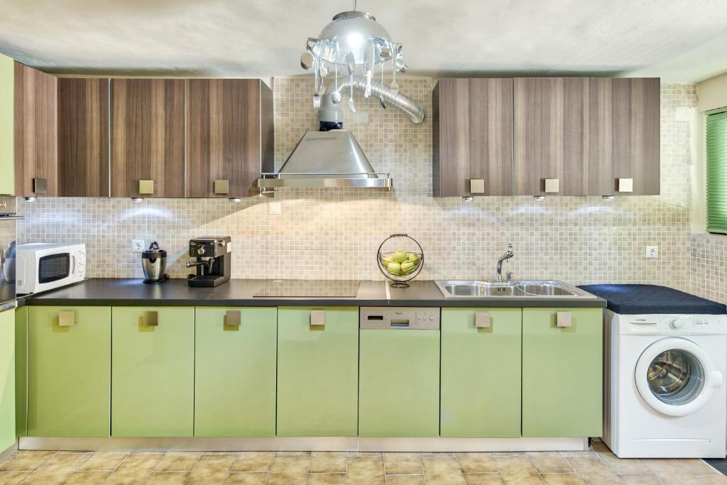 Kuchyň nebo kuchyňský kout v ubytování Villa Canella
