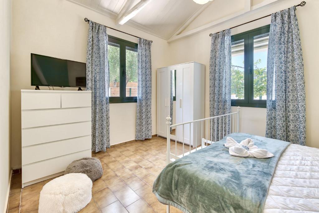 Postel nebo postele na pokoji v ubytování Villa Canella