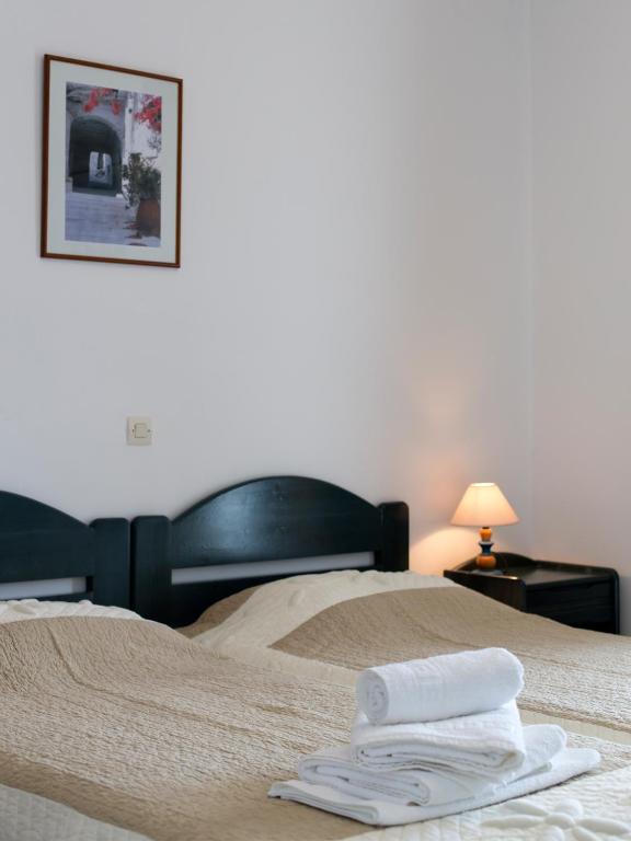 Postel nebo postele na pokoji v ubytování Meltemi Tinos