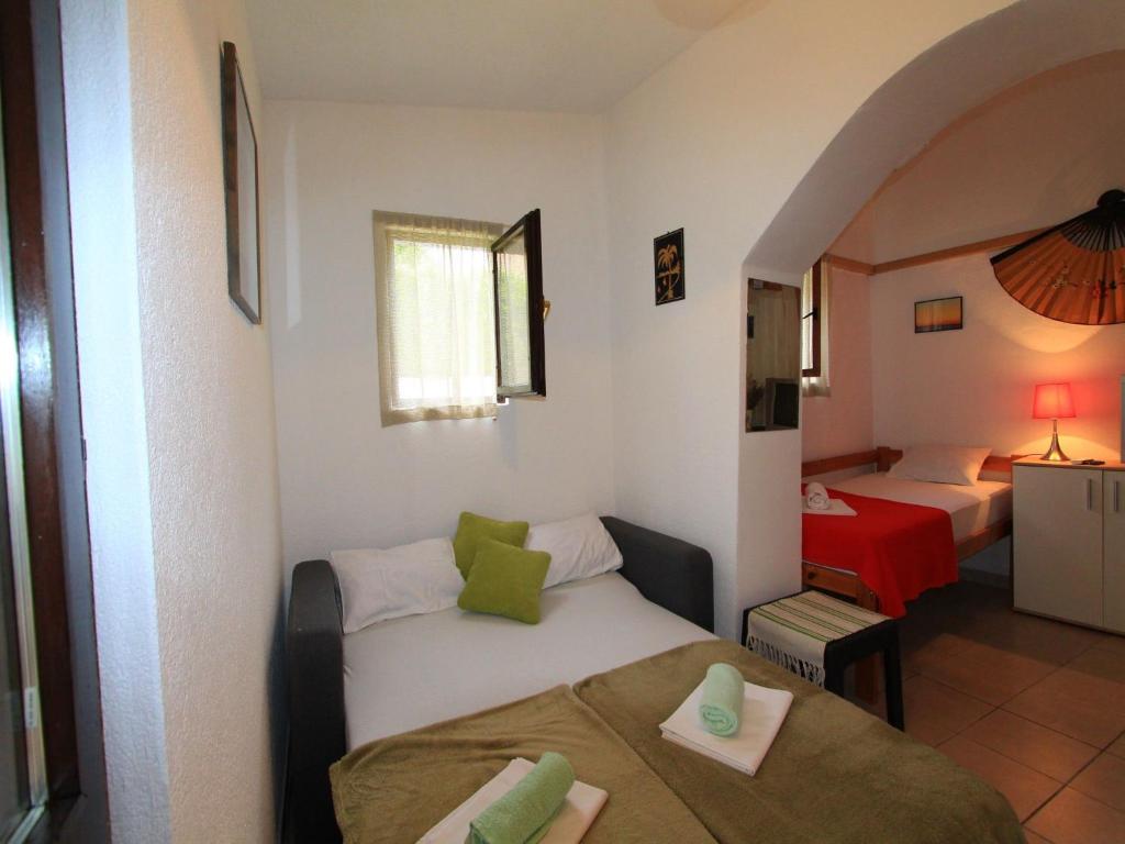 Posteľ alebo postele v izbe v ubytovaní Apartment GIARDINO