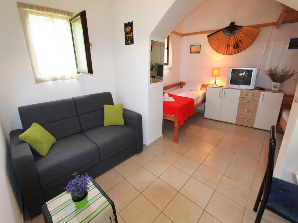 Televízia a/alebo spoločenská miestnosť v ubytovaní Apartment GIARDINO