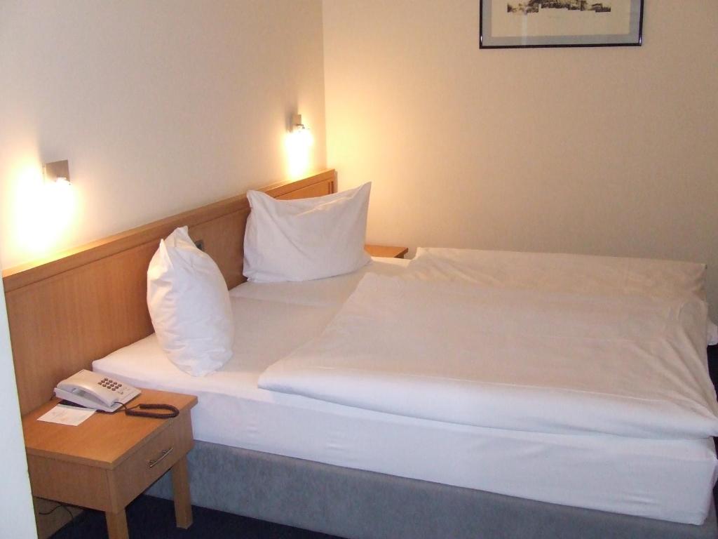 Postel nebo postele na pokoji v ubytování Hotel Tomislavov Dom