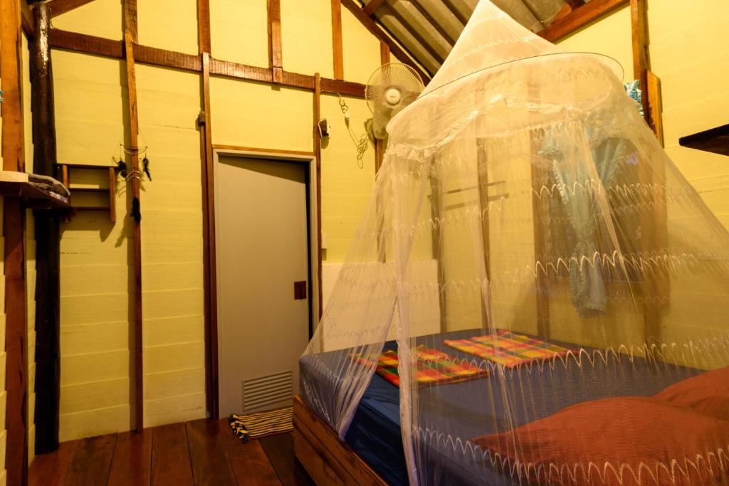 Postel nebo postele na pokoji v ubytování Yak Bungalow