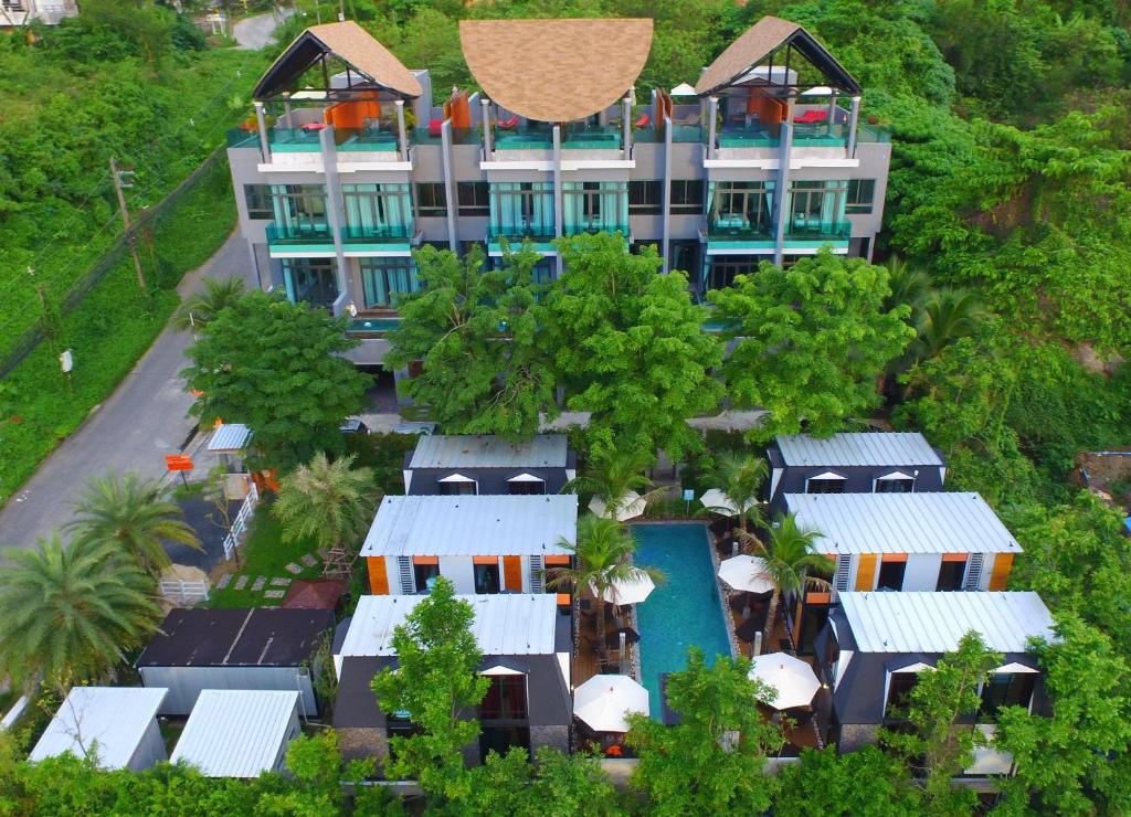 an aerial view of a building with a swimming pool at Bukit Pool Villas - SHA Extra Plus in Patong Beach