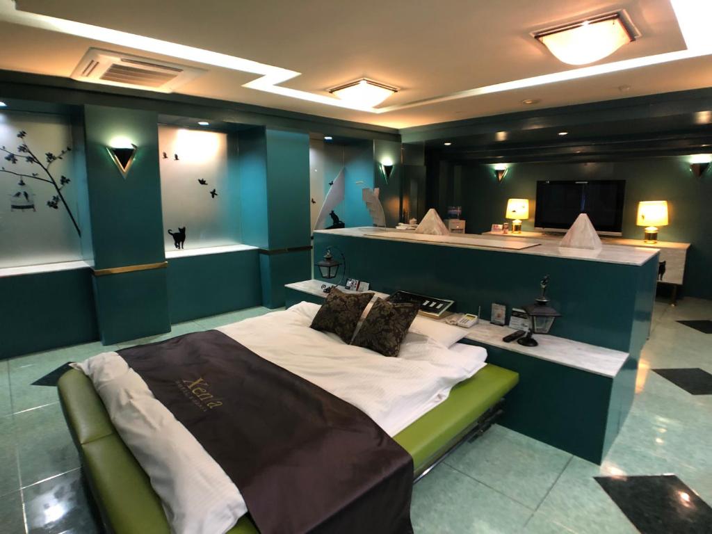 Postel nebo postele na pokoji v ubytování Hotel Xenia Takinoyashiro