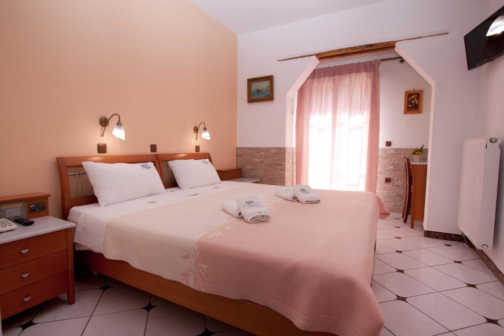 Postel nebo postele na pokoji v ubytování ALK Hotelᵀᴹ