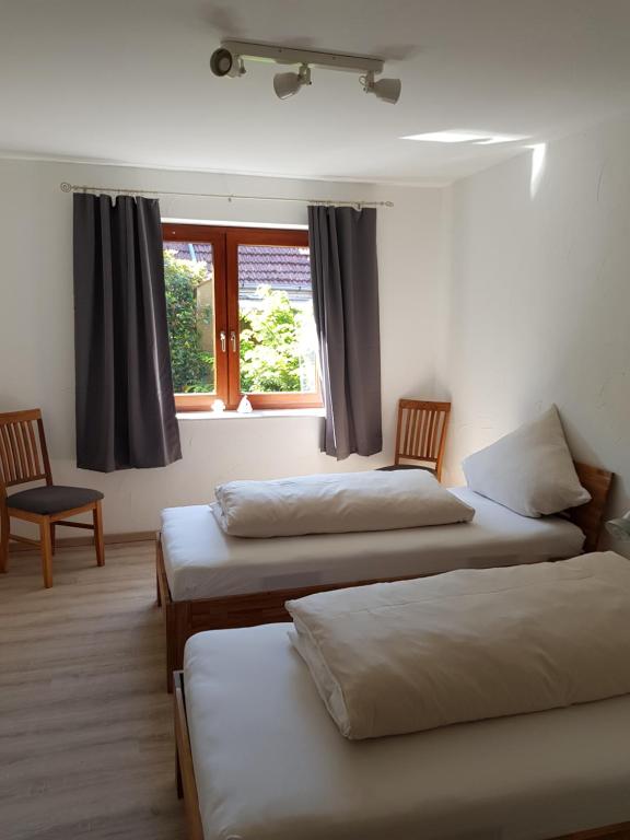 מיטה או מיטות בחדר ב-Hanse Hotel Buxtehude