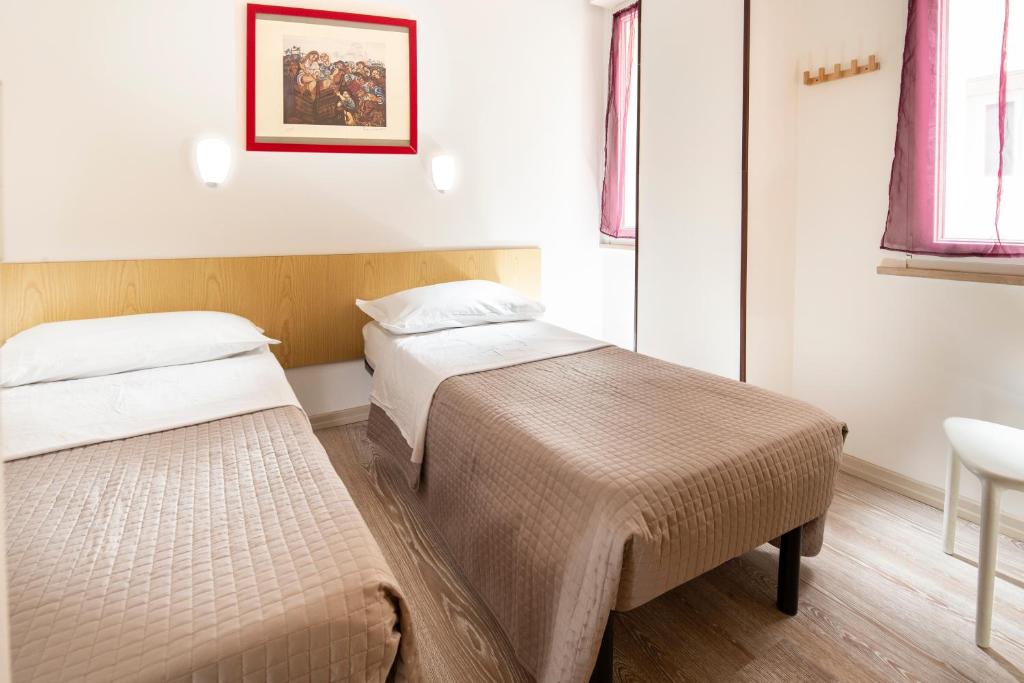 Postel nebo postele na pokoji v ubytování SoleMare Hotel e Residence