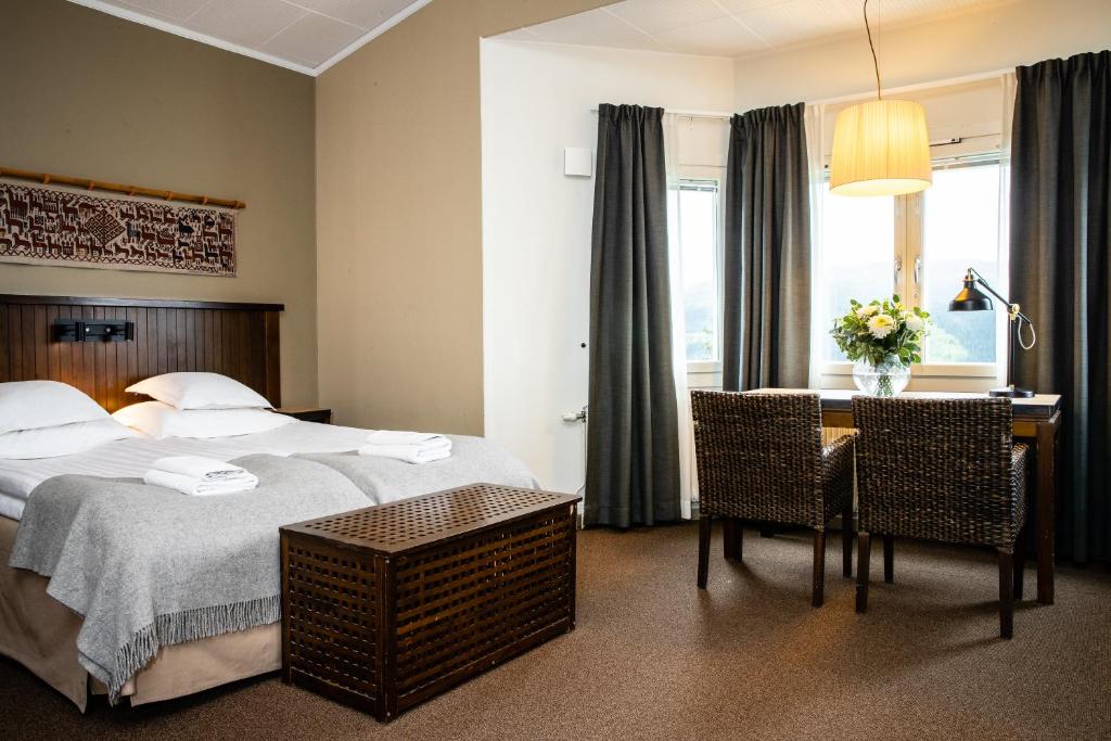Кровать или кровати в номере Hotell Fjällgården Ski-In Ski-Out