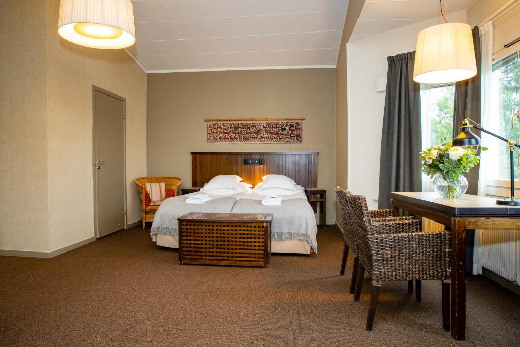 Кровать или кровати в номере Hotell Fjällgården Ski-In Ski-Out