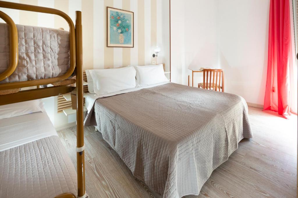Postel nebo postele na pokoji v ubytování SoleMare Hotel e Residence