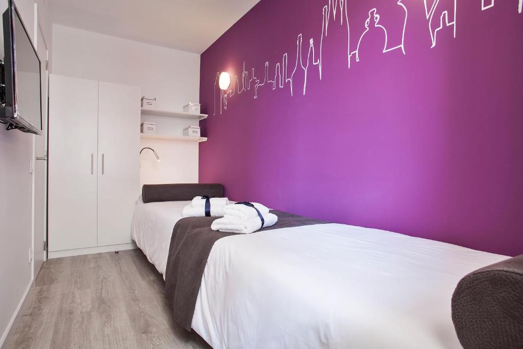 Posteľ alebo postele v izbe v ubytovaní Habitat Apartments ADN