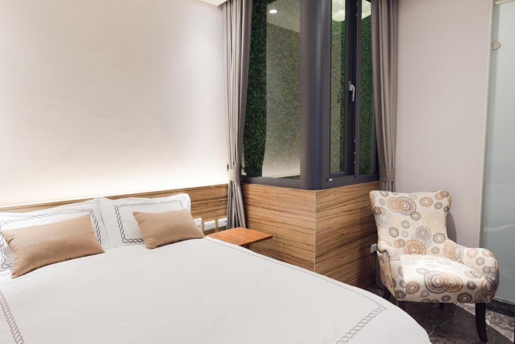 Postel nebo postele na pokoji v ubytování Tianli Hotel