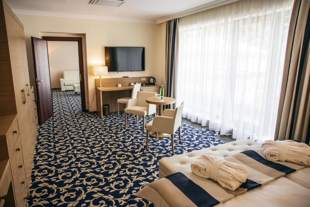 Postel nebo postele na pokoji v ubytování Grandhotel Nabokov