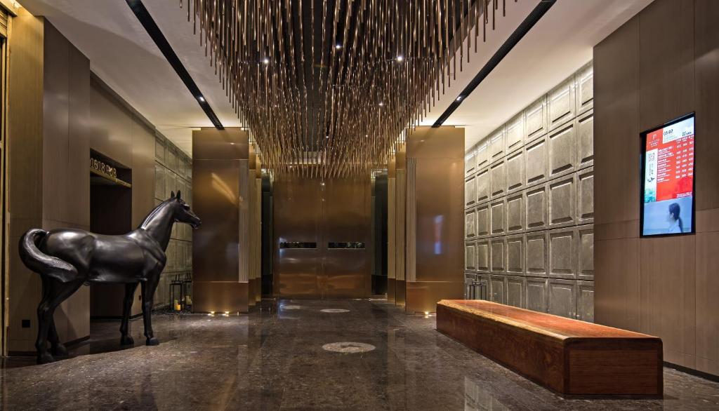 TV a/nebo společenská místnost v ubytování Paco Hotel Chebeinan Metro Guanghzou