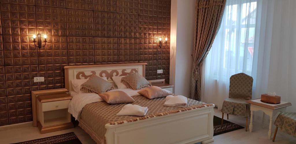 Ένα ή περισσότερα κρεβάτια σε δωμάτιο στο Vila Bohemia