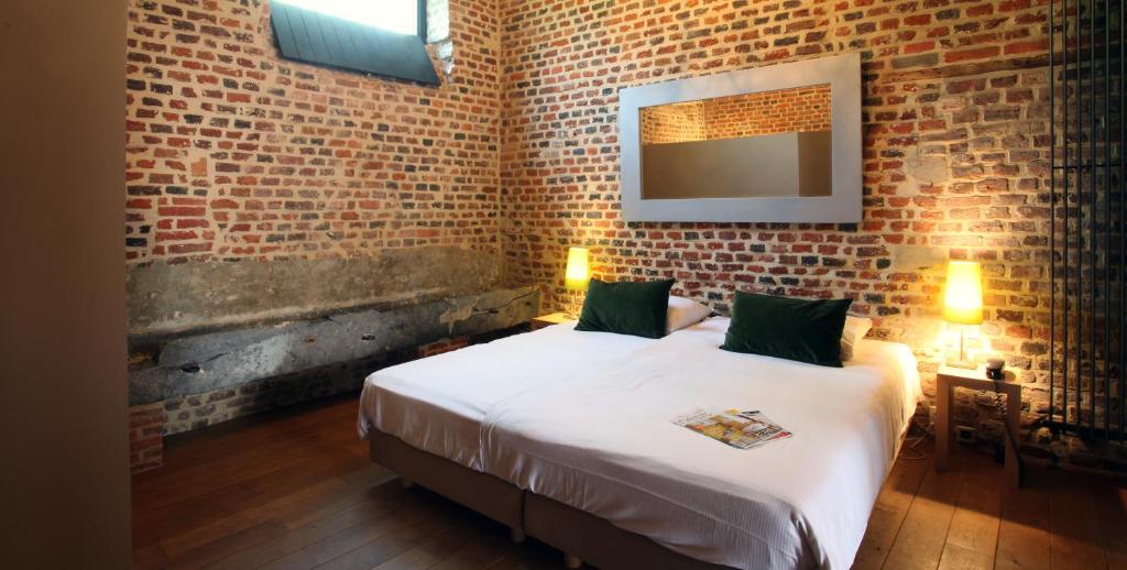 Ένα ή περισσότερα κρεβάτια σε δωμάτιο στο Hotel The Lodge Heverlee