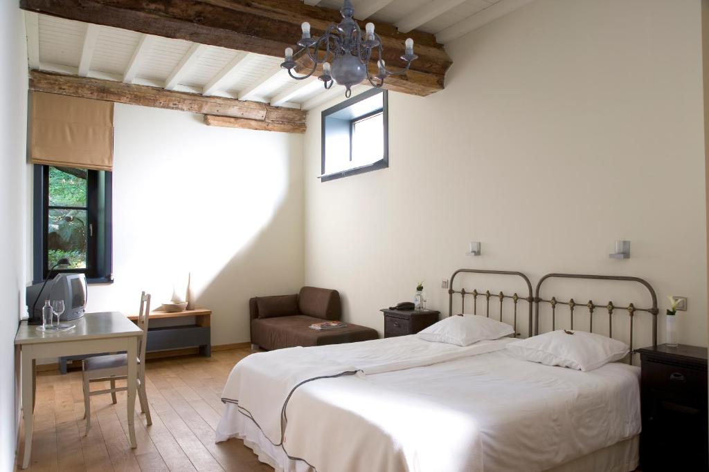 Ένα ή περισσότερα κρεβάτια σε δωμάτιο στο Hotel The Lodge Heverlee