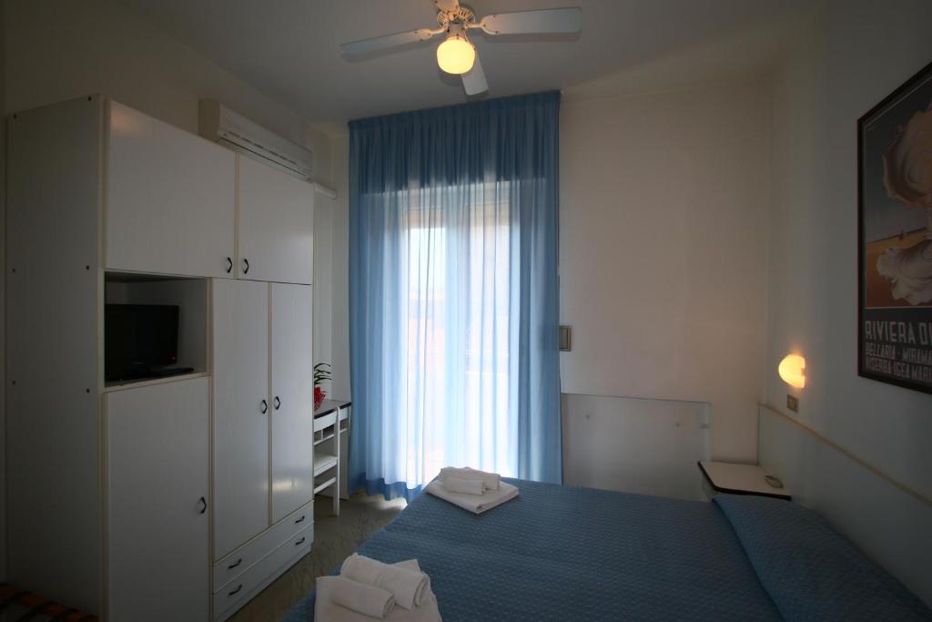 Postel nebo postele na pokoji v ubytování Hotel Tre Assi