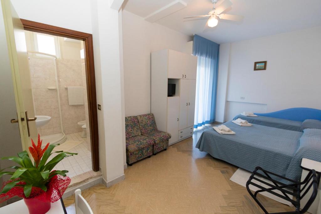 Postel nebo postele na pokoji v ubytování Hotel Tre Assi