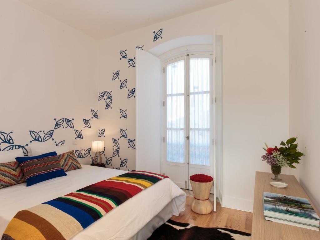 Postel nebo postele na pokoji v ubytování Heaven Inn Suites & Terrace