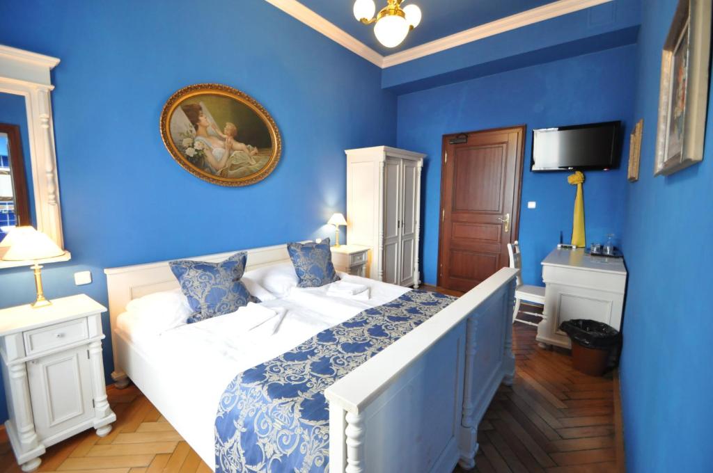 Postel nebo postele na pokoji v ubytování Grand Hotel Praha