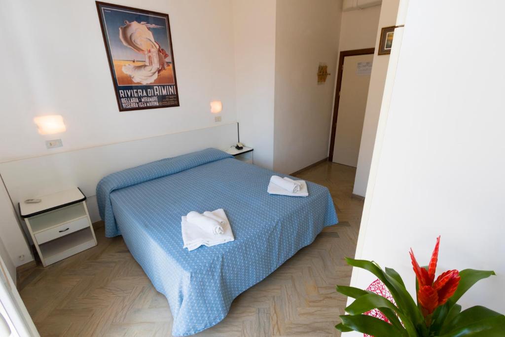 Postel nebo postele na pokoji v ubytování Hotel Tre Assi